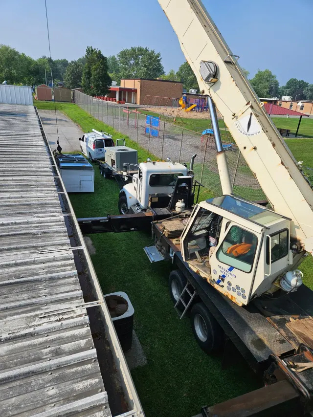 Dixon's field view from an elevated boom-lift during rooftop mechanical work
