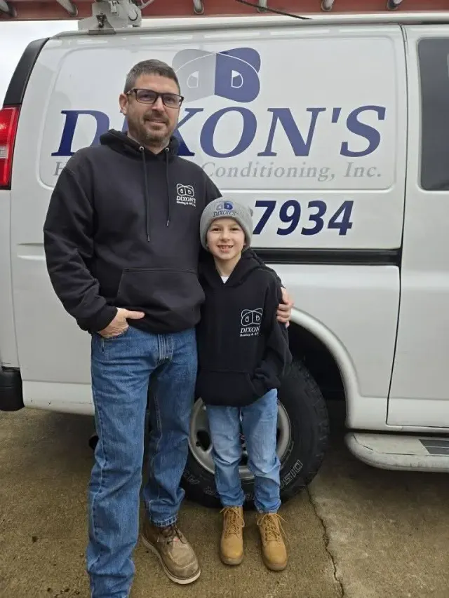 Derek and Brody in front of the Dixon's service van